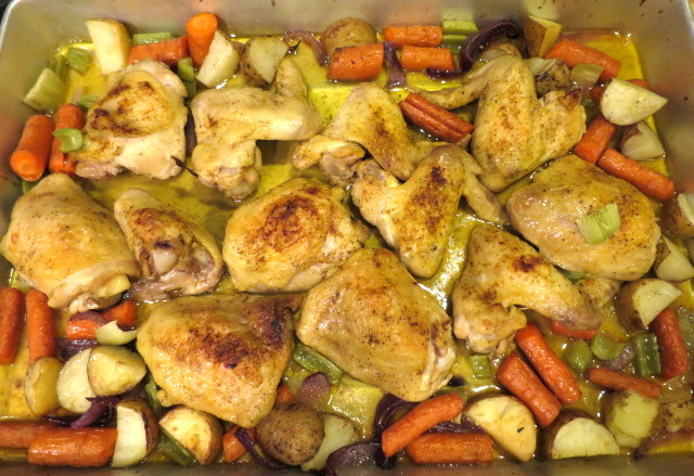 A baking sheet of roasted chicken and vegetables