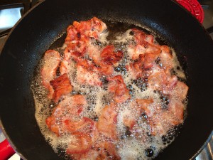 Cook bacon until mostly done.